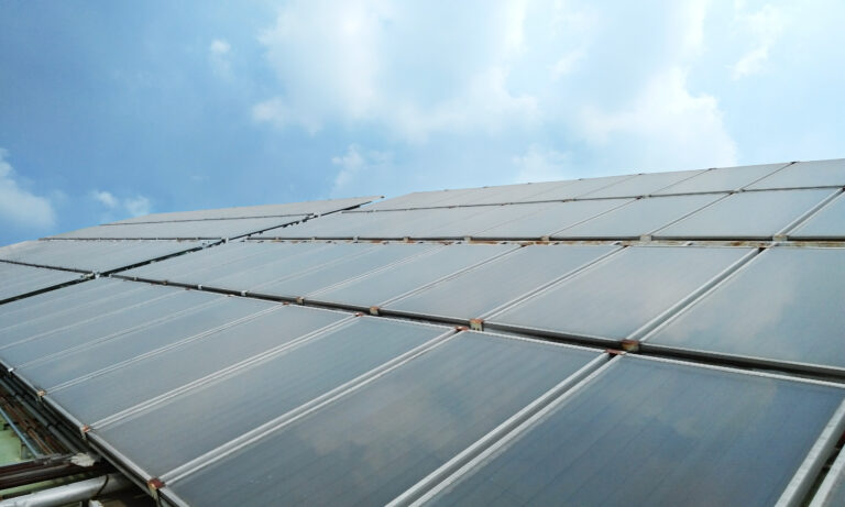 solar-heat-hot-water-supply-building-with-sunlight-blue-sky-energy-savings-concept (1)